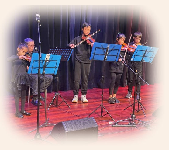 Progressive Violin Tuition students performing at Fete dela Musique 2024. Violin Teacher Palmerston North